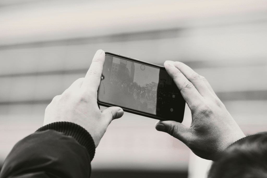Person recording a conversation on a smartphone