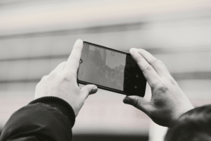 Person recording a conversation on a smartphone
